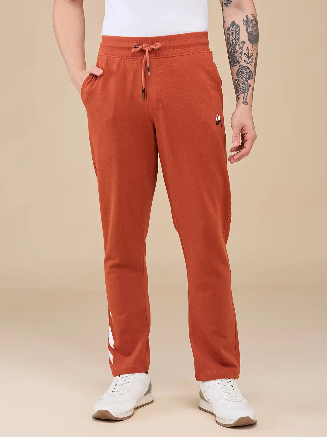 Orange Regular fit Men's Track Pants by Being Human Clothing